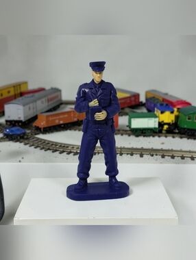 Patrol Officer Miniature Collectible Model Train Accessory Holding Ticket Book.
